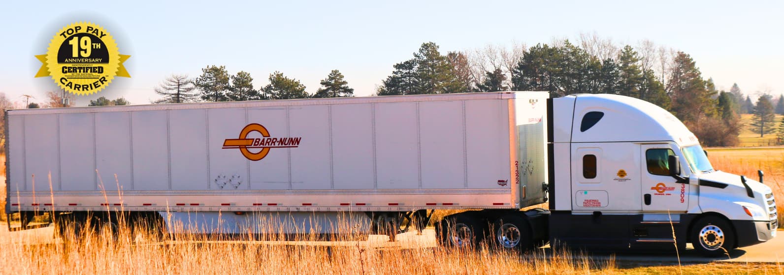 Barr-Nunn Truck with company facts and Top Pay Certified Carrier logo