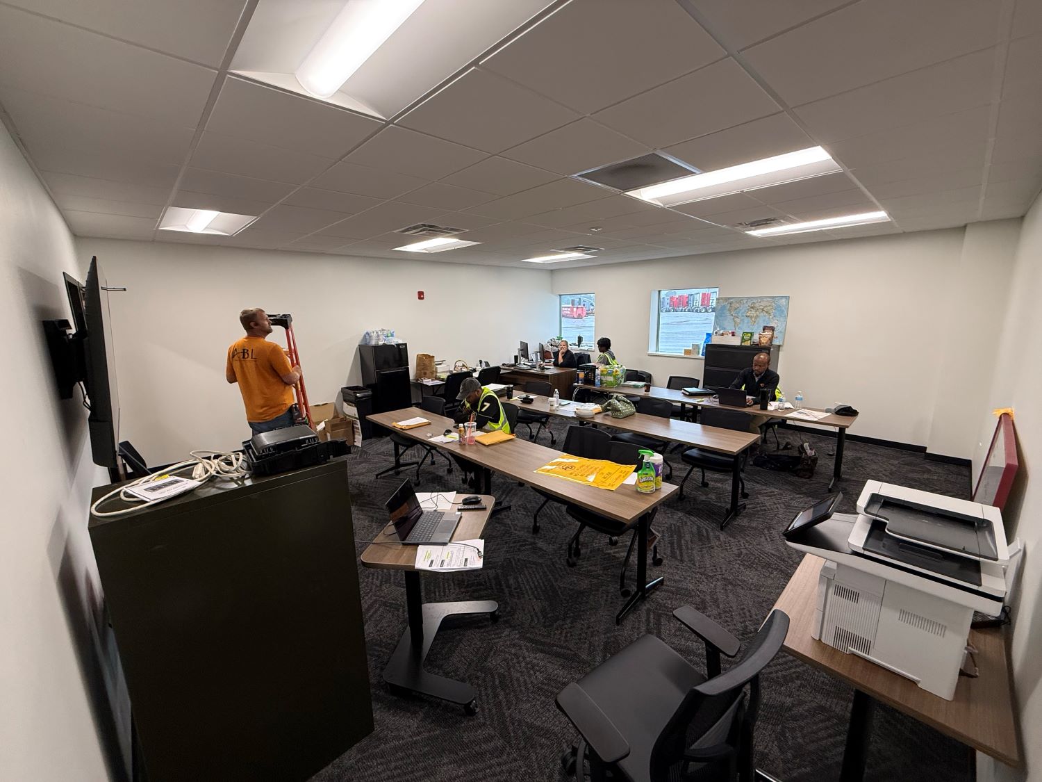 Barr-Nunn Shippensburg, PA truck terminal building showing driver training room desks, chairs, whiteboard, and television